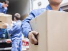Movers unloading a moving van